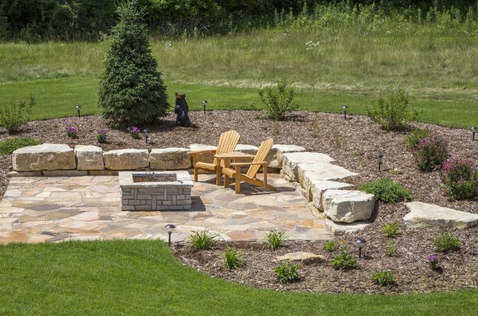 The fire pit adds a functional and aesthetic element to the yard.